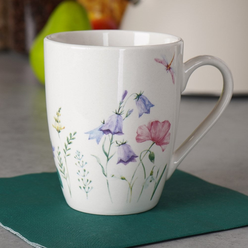 White porcelain cup with floral design, comfortable handle, dishwasher safe