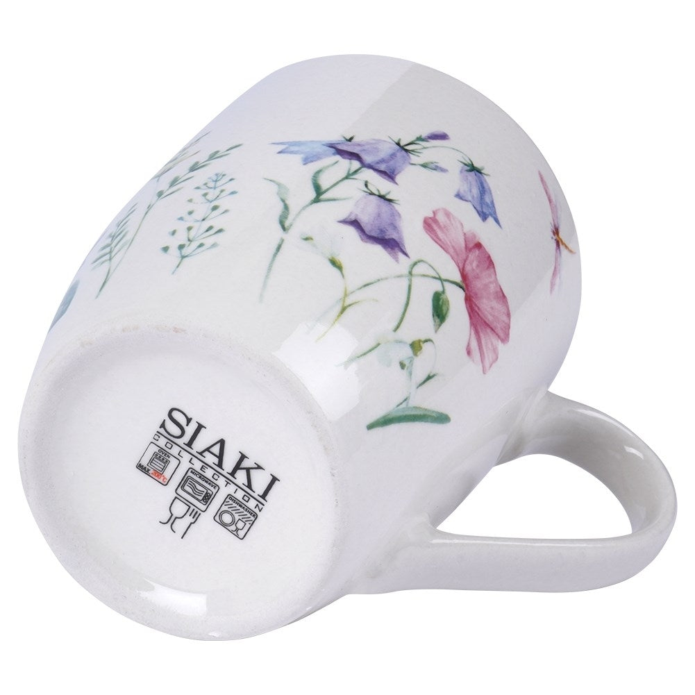 White porcelain cup with floral design, comfortable handle, dishwasher safe