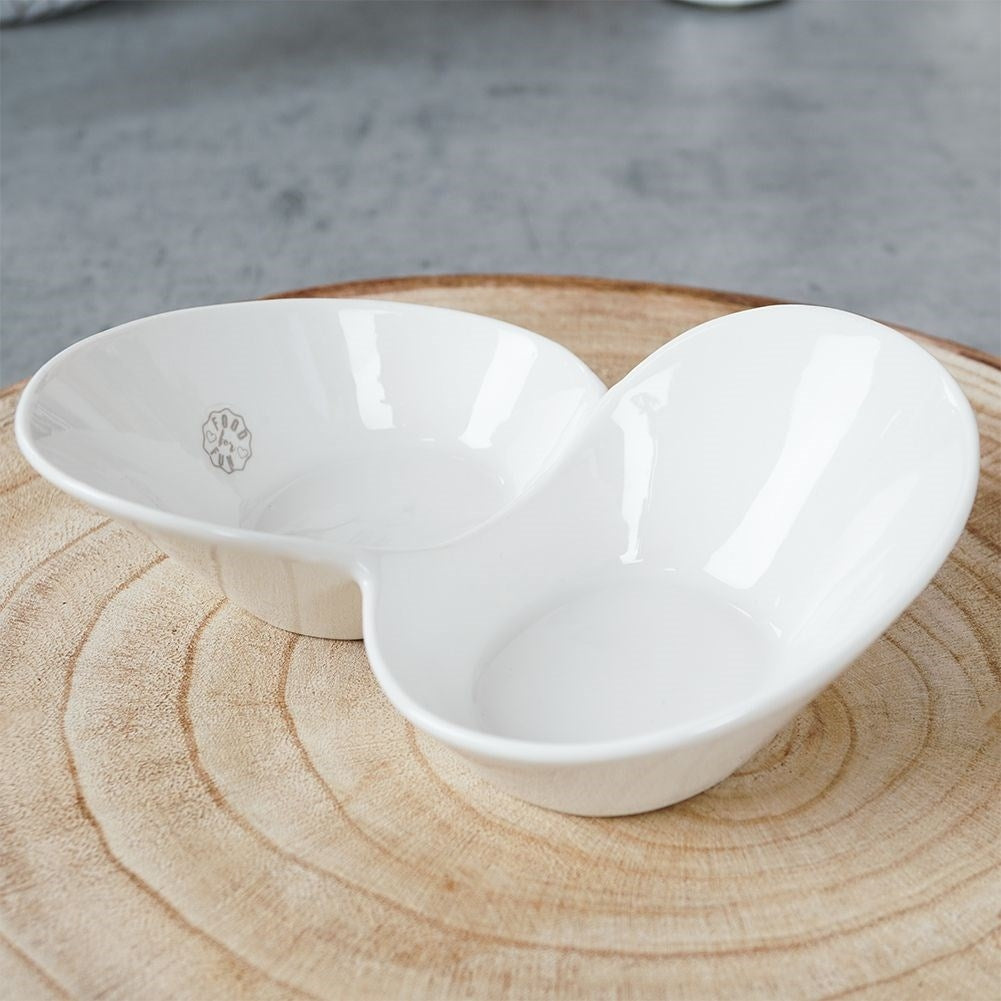 White porcelain snack bowl with two separate compartments