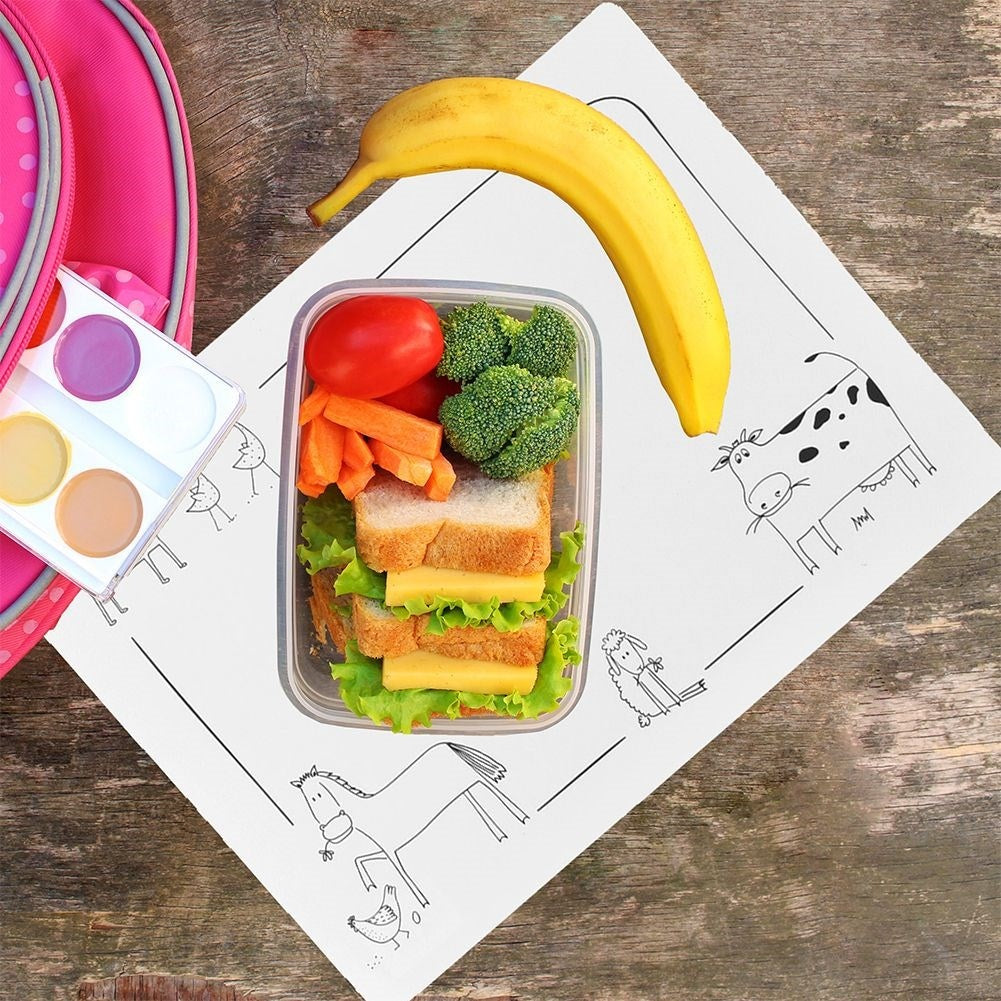 White rectangular plastic placemat with animal motif