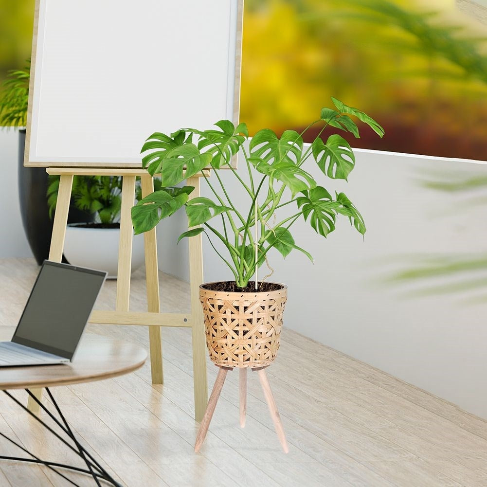 Wicker flower pot on wooden legs for boho style, live/artificial plants