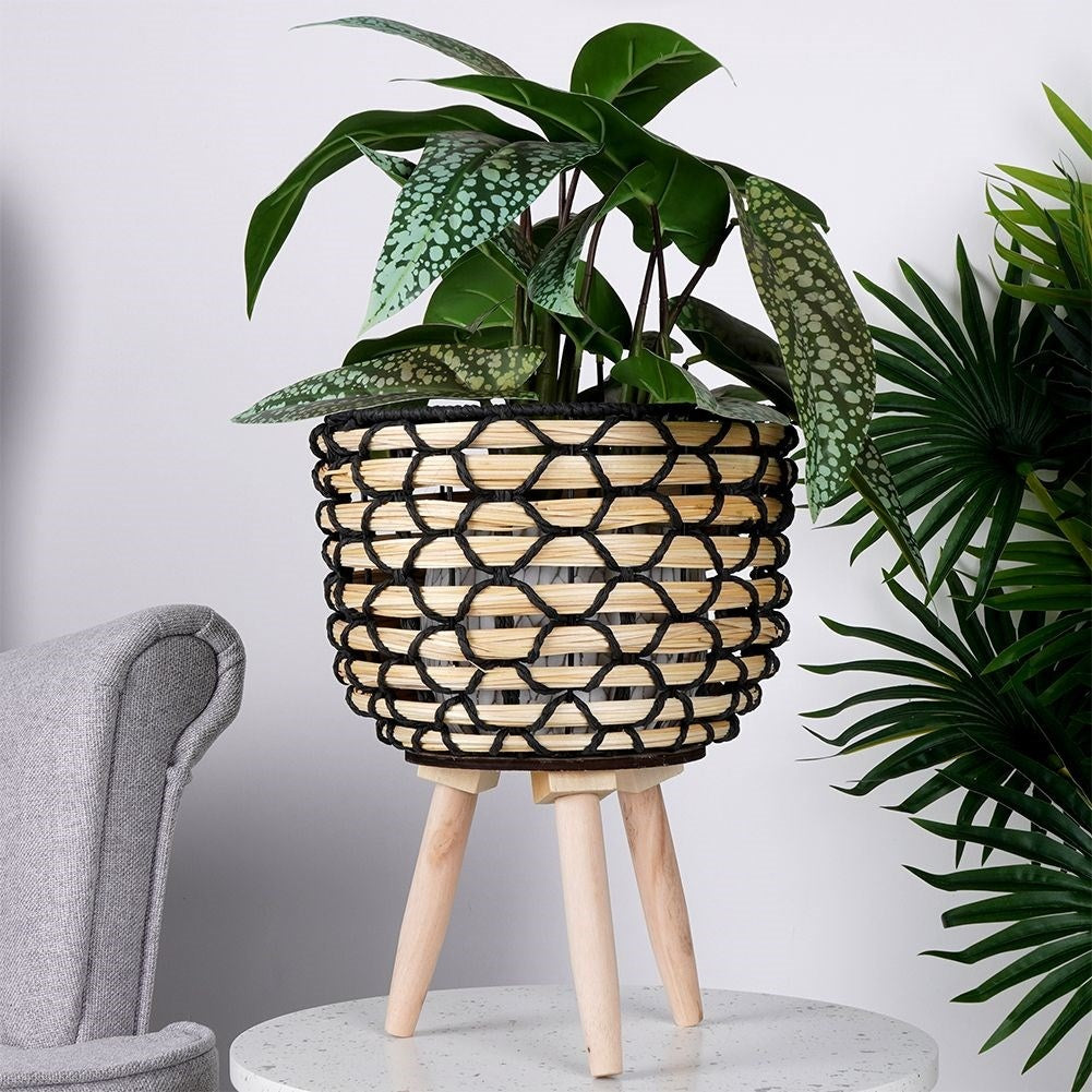 Wicker flower pot with wooden legs for boho decor