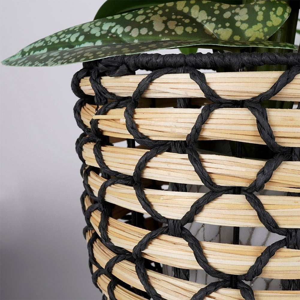 Wicker flower pot with wooden legs for boho decor