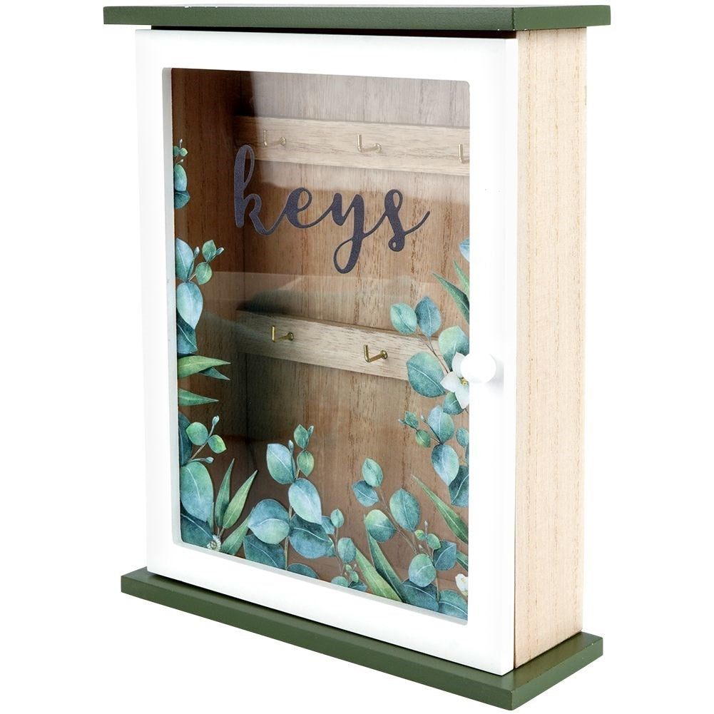 Wooden cabinet with glass doors and leaf motif for keys