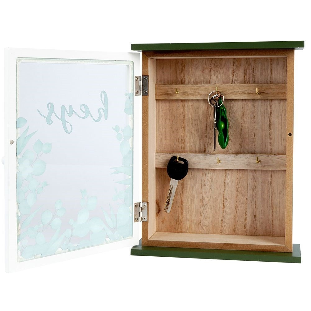 Wooden cabinet with glass doors and leaf motif for keys