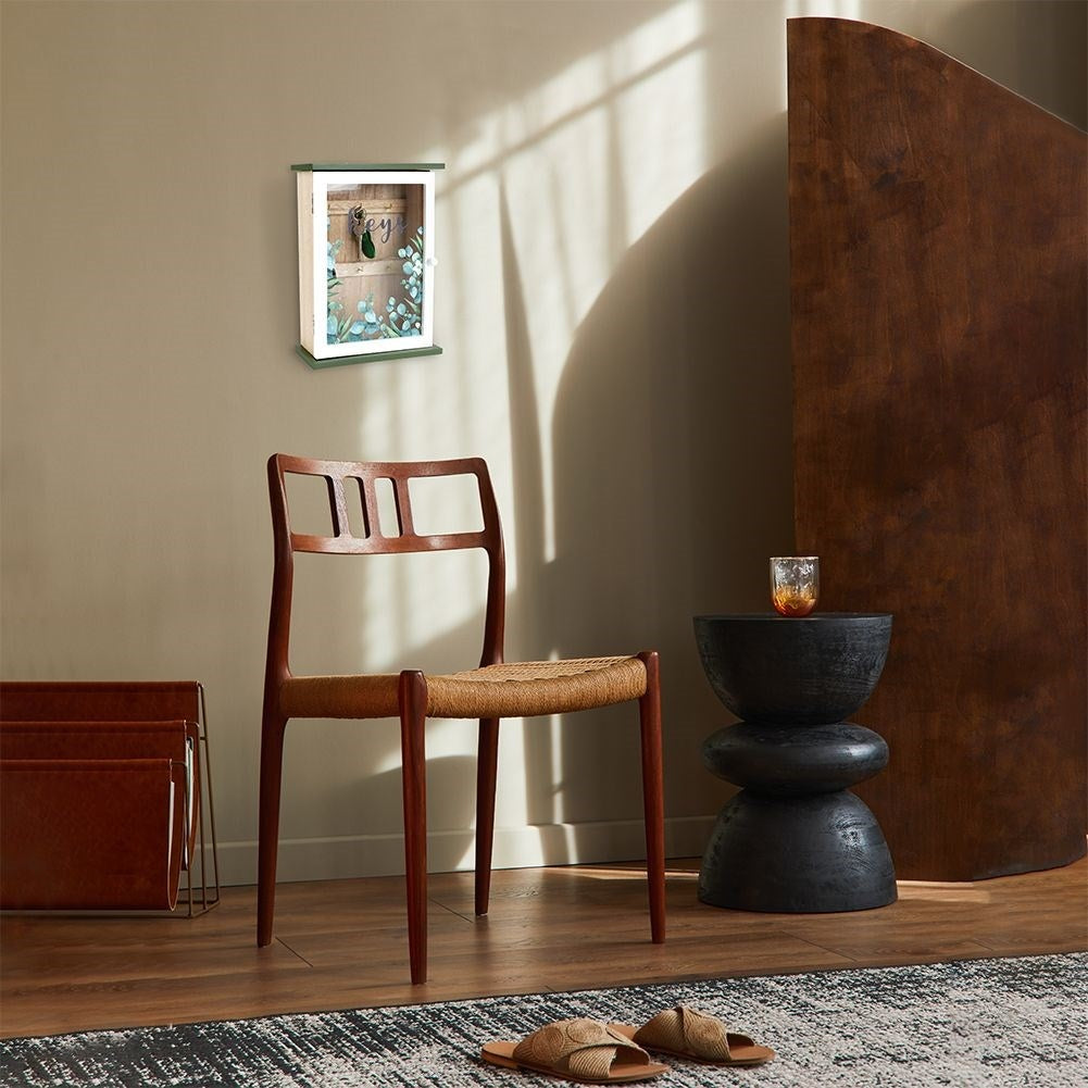 Wooden cabinet with glass doors and leaf motif for keys