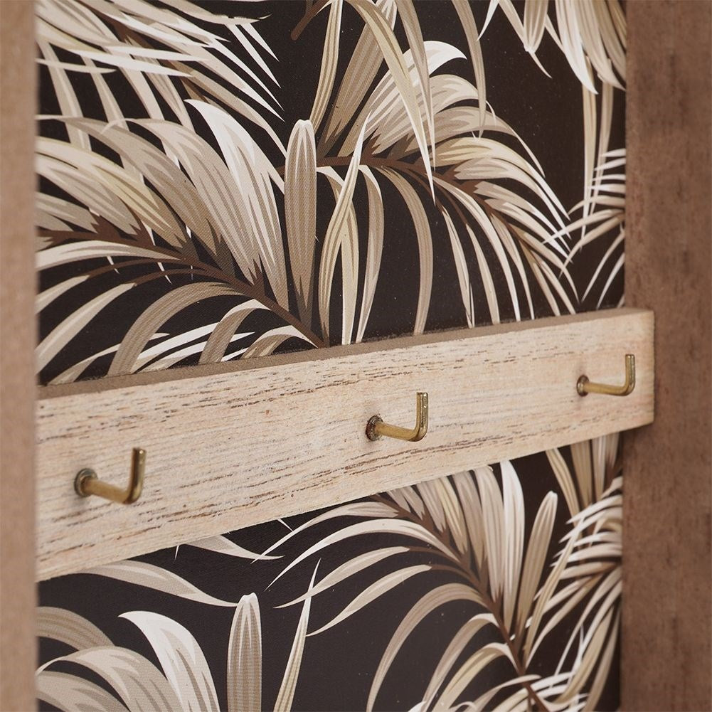 Wooden cabinet with print and six golden hooks for keys
