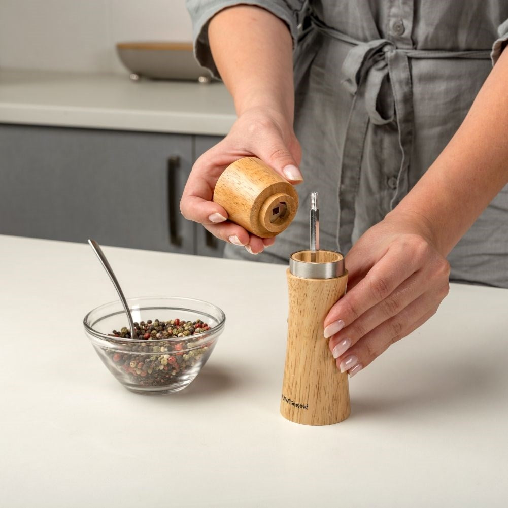 Wooden mortar in bamboo with ceramic grinders for pepper and salt
