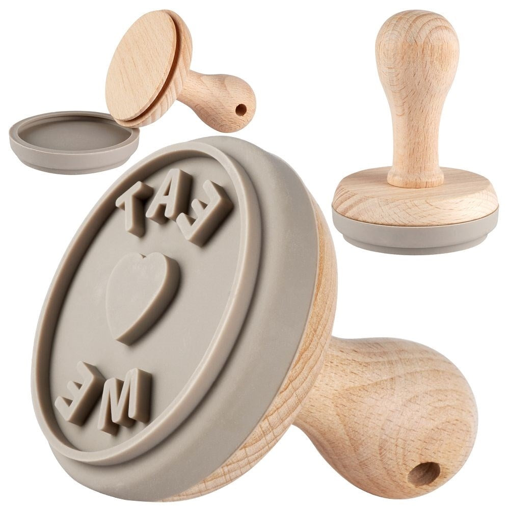 Wooden stamp for cake decoration with the text Eat Me