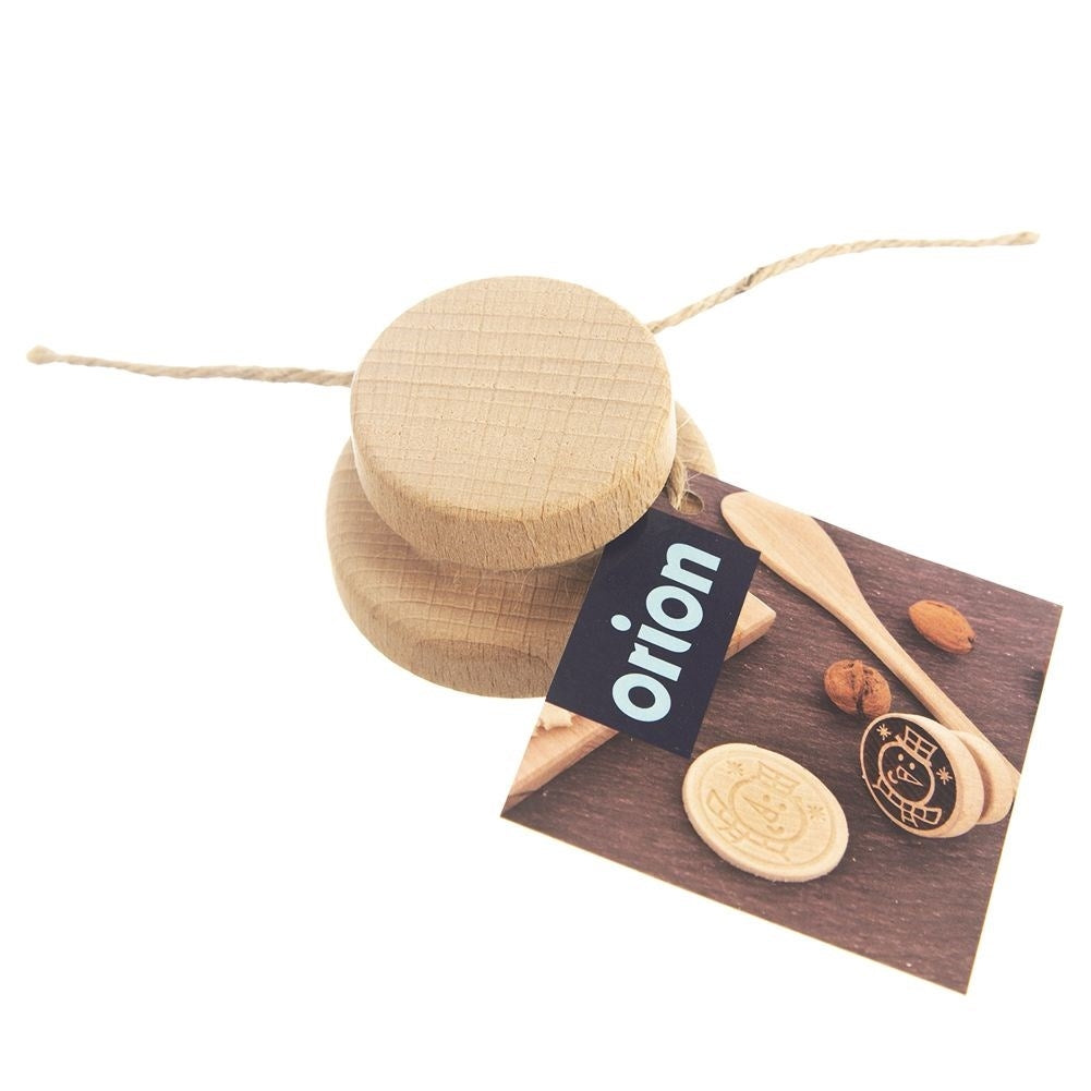 Wooden stamp with snowman motif to decorate cookies and gingerbread