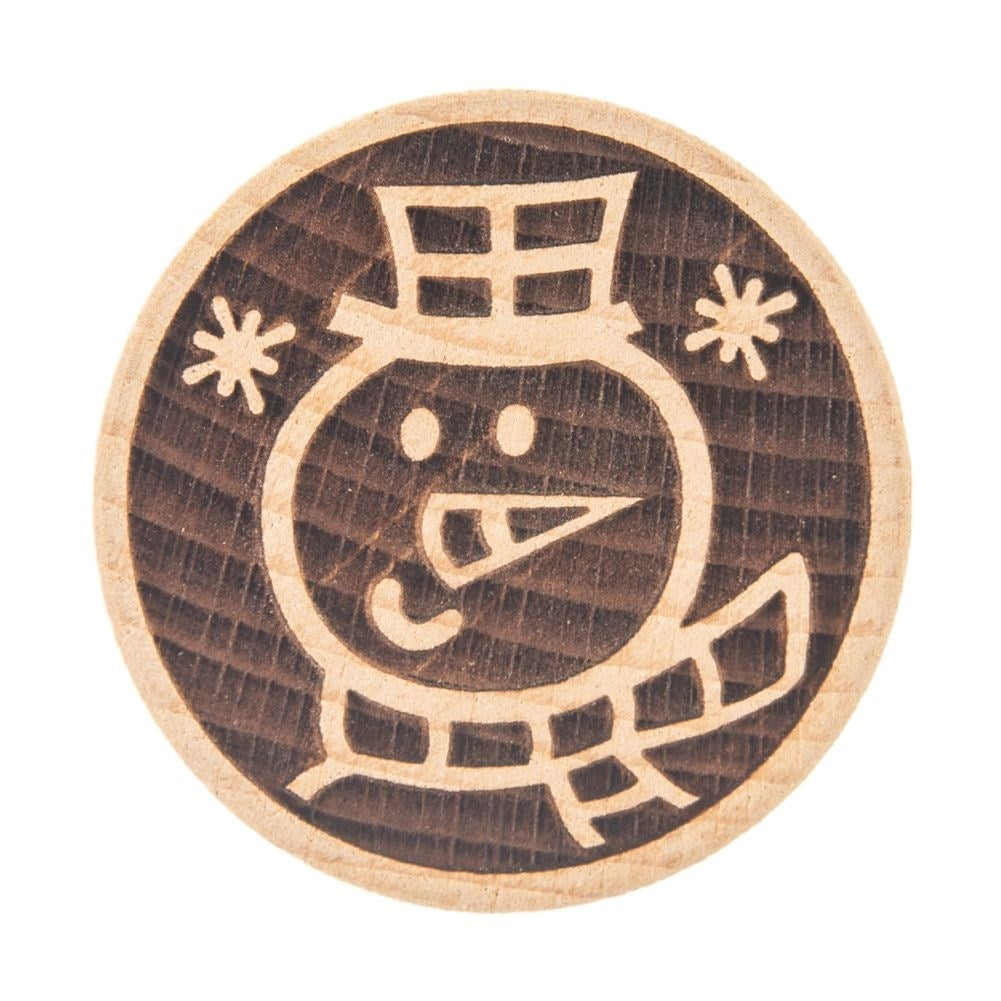 Wooden stamp with snowman motif to decorate cookies and gingerbread