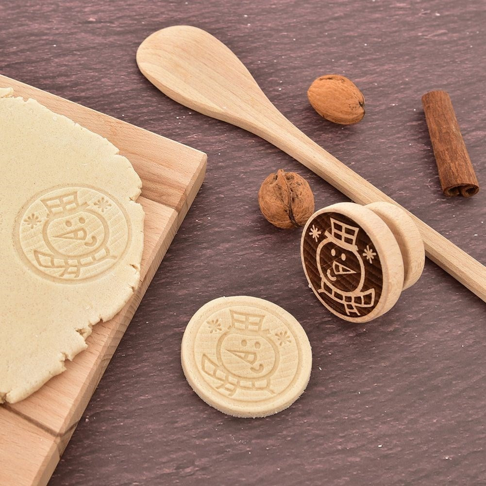 Wooden stamp with snowman motif to decorate cookies and gingerbread