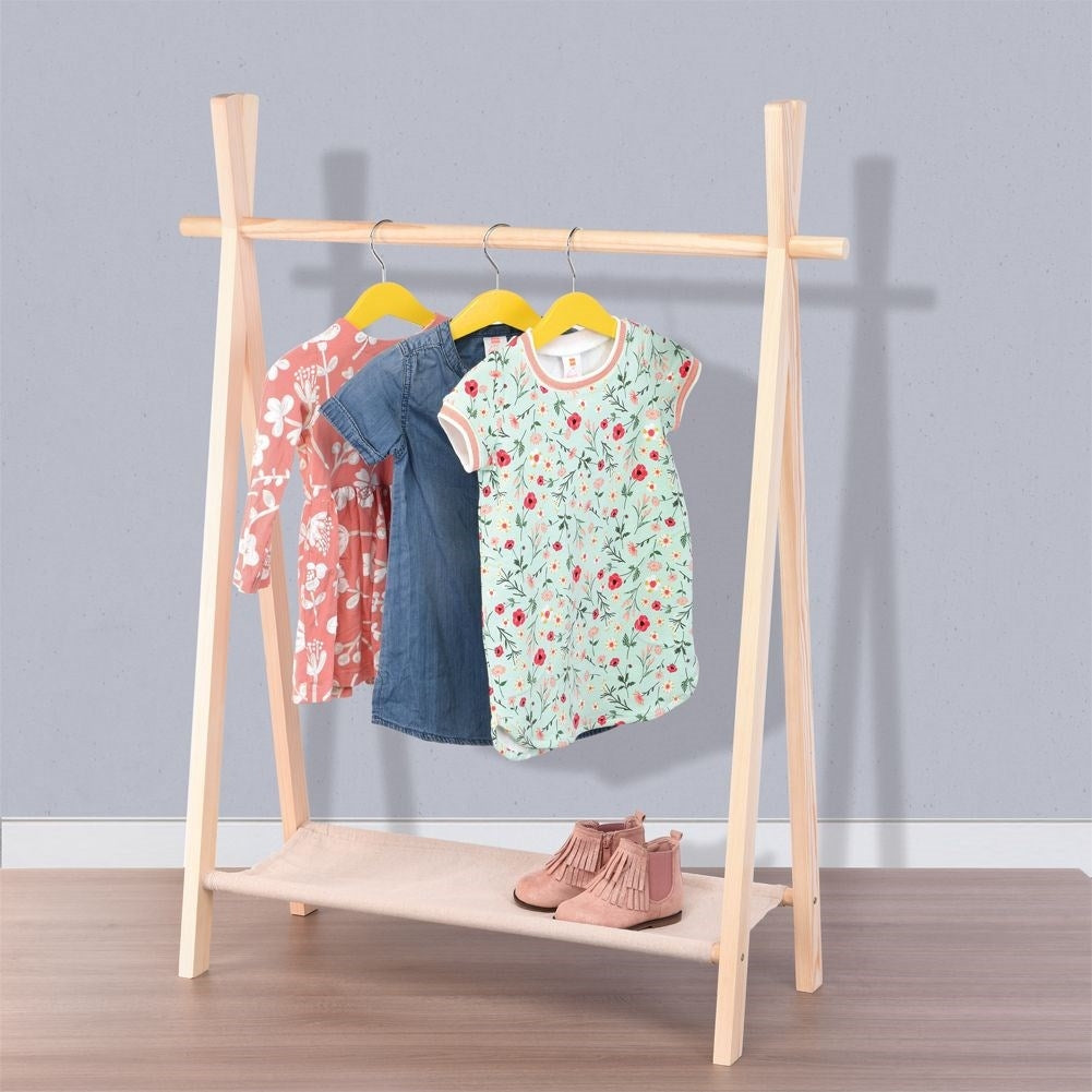 Wooden wardrobe with hangers for children's clothes and shoes